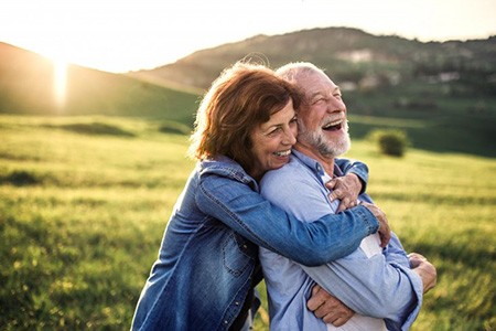 Couple embracing and enjoying the great outdoors